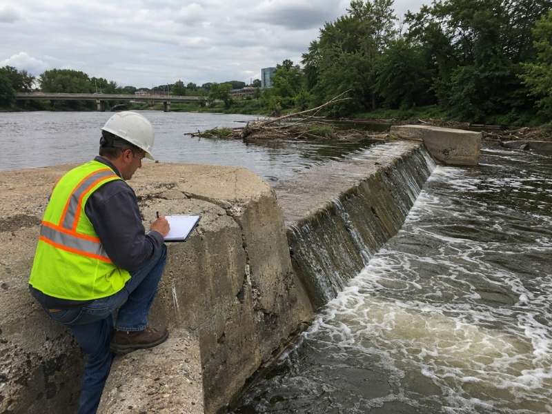 Dam inspection of an existing low head concrete dam before removal in Grand Rapids Michigan