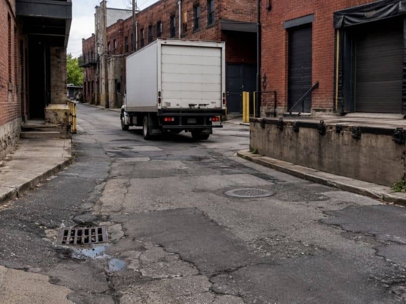 A freight alley in Grand Rapids being evaluated by a roadway engineer before reconstruction